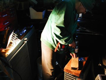 Dad drilling geodesic parts in the shed