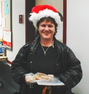 Dr. Jessica Kun at Christmastime bearing cookies