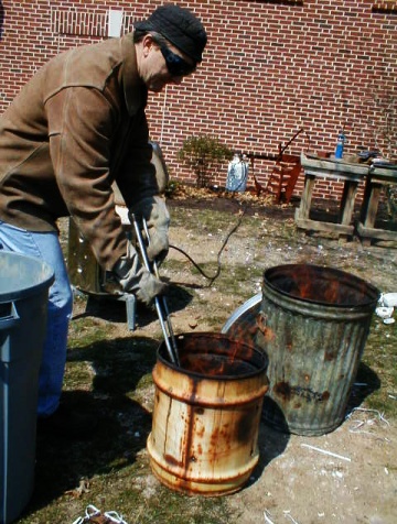 See Milt Friedly put orange-hot ceramics into pit of sawshavings.