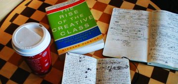 The Rise of the Creative Class on a chessboard with notes at a Starbucks on Thanksgiving Day, 2004