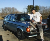 J. Nathan Matias posing with his 'Vintage' '89 Plymouth Horizon